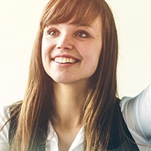 Woman smiling with arm raised