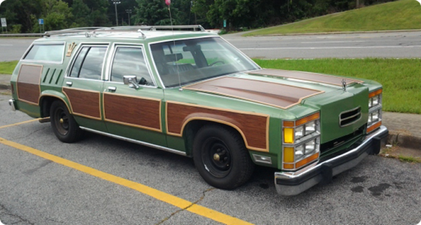 A 1986 Wagon Queen Family Truckster in Pea Green with genuine faux wood paneling